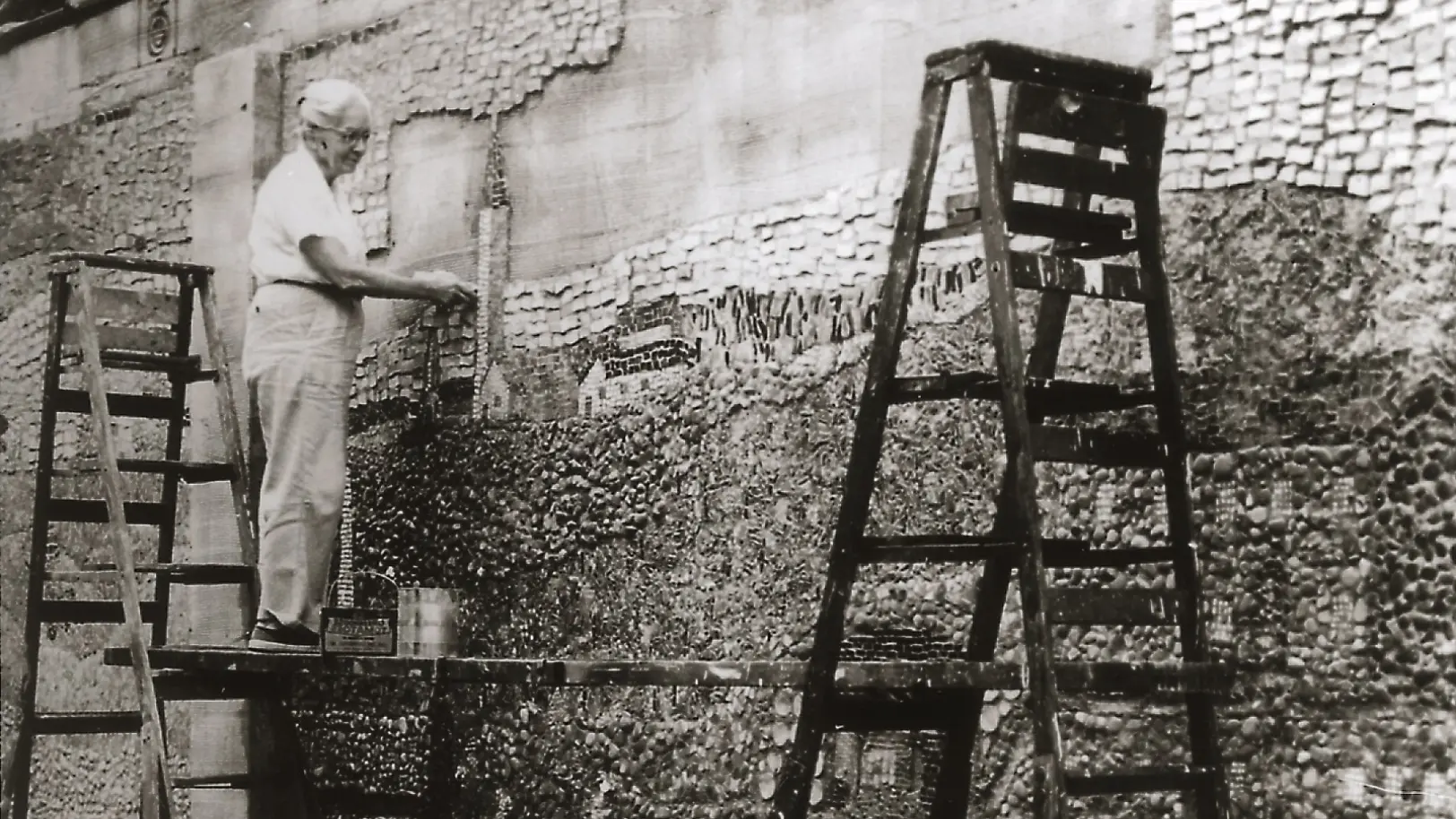 Historical Photo of artist creating tiled mural wall at the Kemper Center grounds in Kenosha, Wisconsin